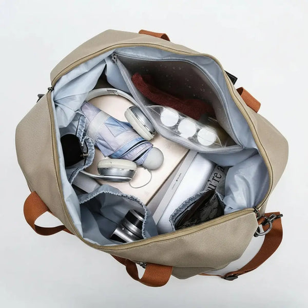 Open beige backpack with various items and a 'wet' label on a light gray background
