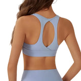 Light blue sports bra worn by a person on a plain background