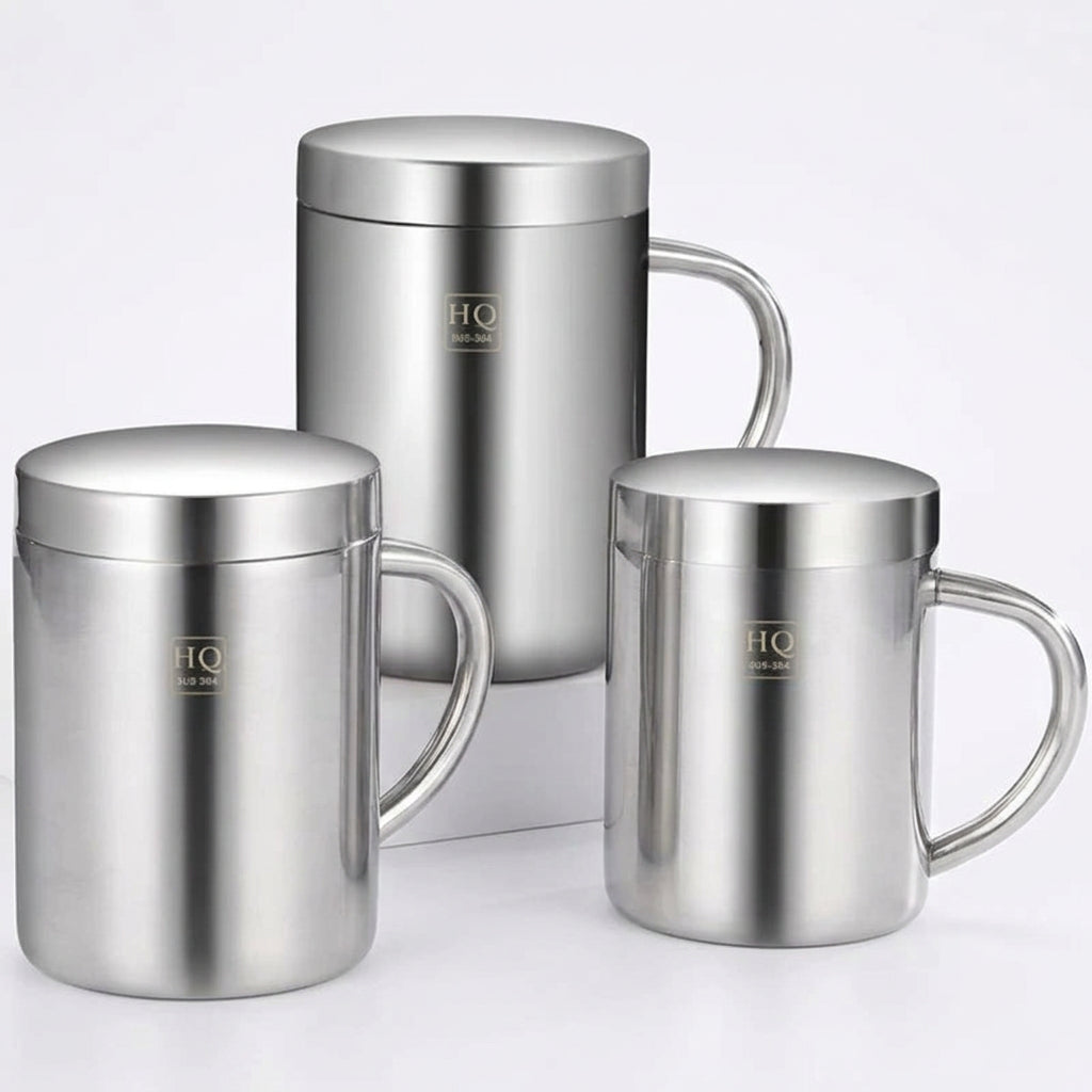 Three stainless steel mugs with 'HQ' branding on a dark surface.