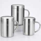 Three stainless steel mugs with 'HQ' branding on a dark surface.