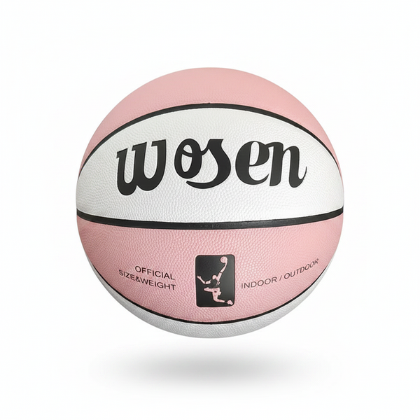 Pink and white basketball with 'wosen' branding held by a hand against a chain-link fence background.