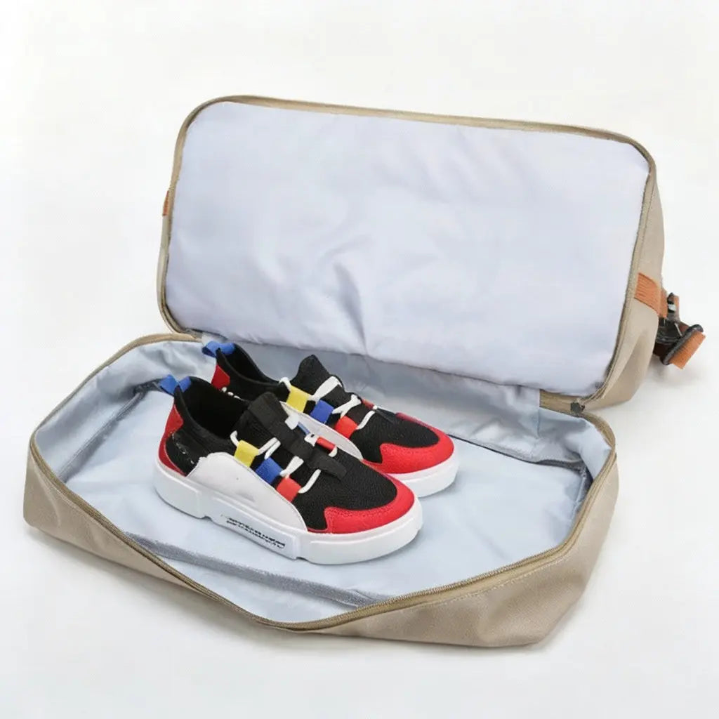 Open beige shoe storage bag with colorful sneakers inside on a light gray background