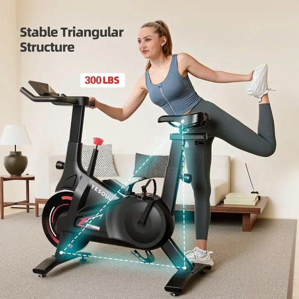 Woman exercising on a stationary bike with text highlighting stability and weight capacity.