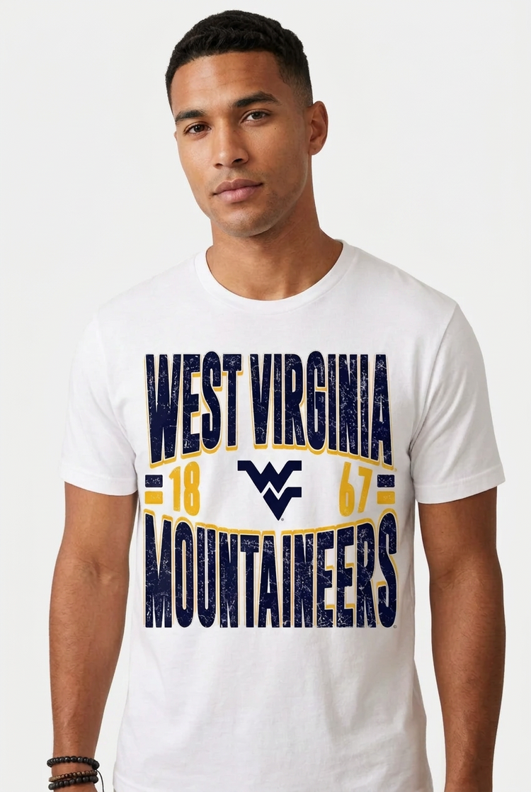 A white short-sleeve crewneck t-shirt featuring a distressed graphic print on the front with the text 'WEST VIRGINIA MOUNTaineers', the number '18', the West Virginia 'W' logo, and the number '67' in navy blue and yellow.