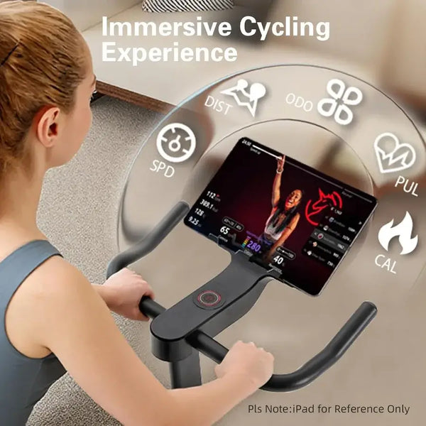 Person using a cycling simulator with a digital display showing various metrics.