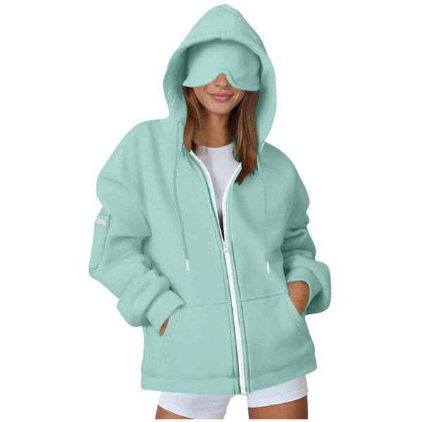 Light blue hoodie with a built-in eye mask worn by a person on a white background