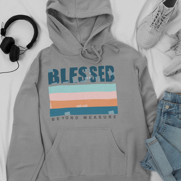 Gray hoodie with 'Blessed Beyond Measure' text, headphones, sneakers, and jeans on a white background