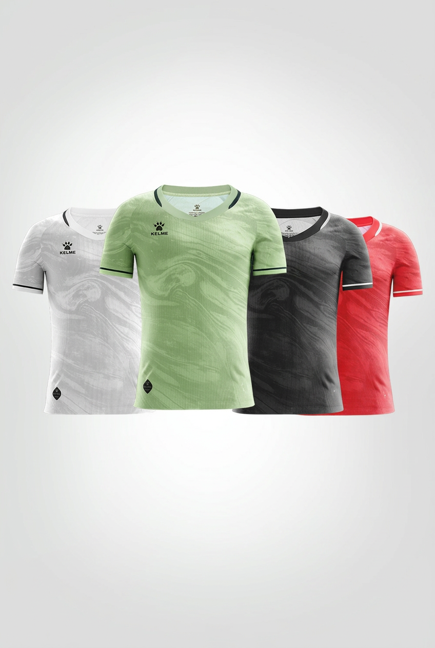Four short-sleeve athletic jerseys shown side by side on a light gray background: white, light green, dark gray, and red. Each shirt has a subtle tonal pattern, a V-neck, and small black logo details on the chest and sleeve cuffs.