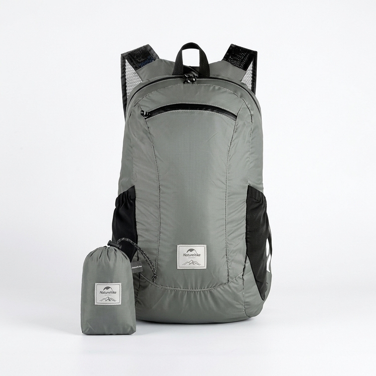 Gray foldable backpack and pouch on white