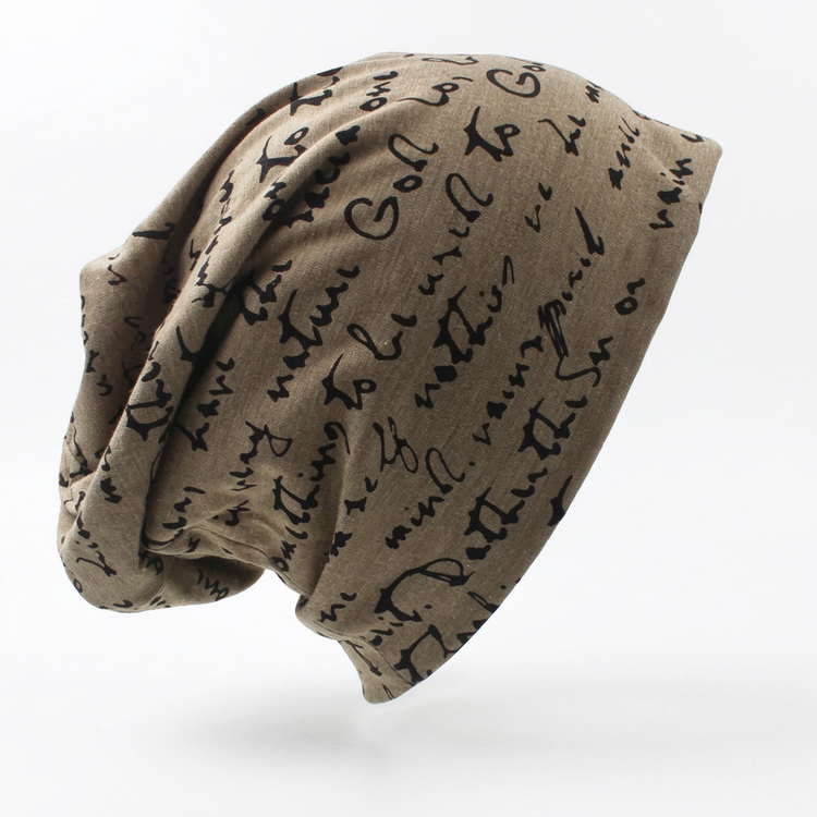 Tan printed beanie with black lettering on a white background with a soft shadow