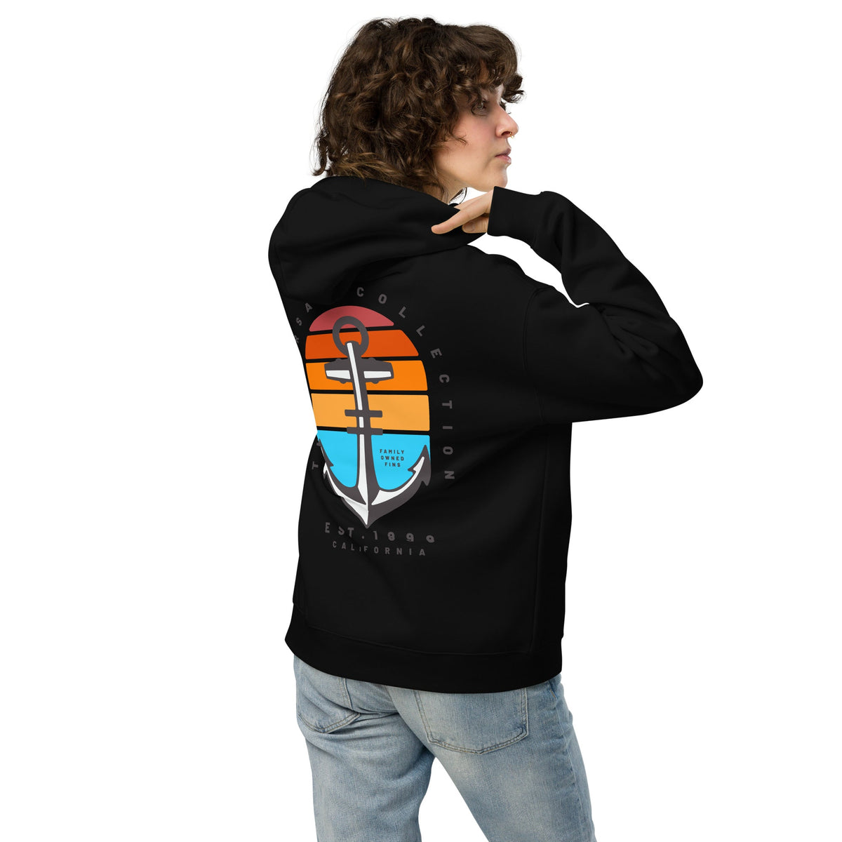 Person wearing a black hoodie with a colorful logo on the back, standing against a white background