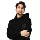 Man wearing a black hoodie with a logo on a white background