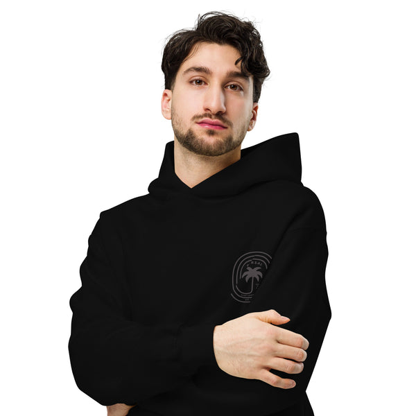 Man wearing a black hoodie with a logo on a white background